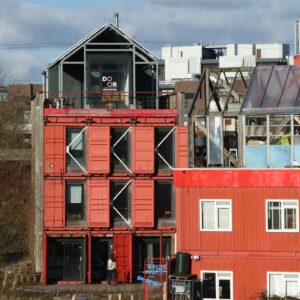 Unique shipping container buildings in Amsterdam showcasing innovative urban architecture.